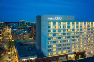 a building with a sign on top of it in a city at Hotel Clio, a Luxury Collection Hotel, Denver Cherry Creek in Denver
