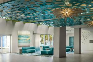 a lobby with a blue and gold ceiling at The Westin Resort & Spa Cancun in Cancún
