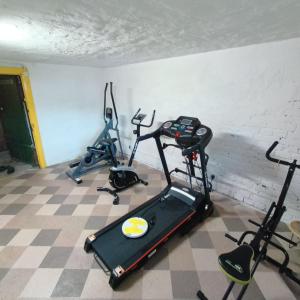 a room with two exercise bikes and a treadmill at Giżycko in Giżycko