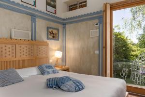 A bed or beds in a room at La Cucchetta