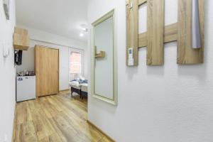 a room with a hallway with a door and a kitchen at Villa Trofej in Ohrid