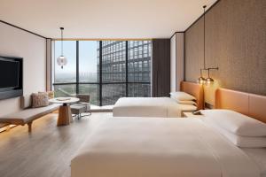 Postel nebo postele na pokoji v ubytování Sheraton Xi'an Chanba