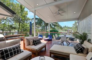 an outdoor living room with furniture and a patio at Grevillea in Point Lookout