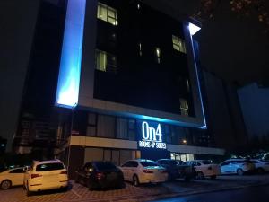 a building with cars parked in front of it at night at On4 Rooms & Suites in Istanbul