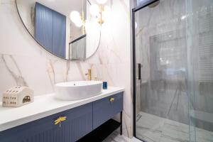 Kúpeľňa v ubytovaní Lake Park Apartament + 15 fotografií
