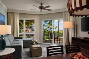 a living room with a couch and a table with chairs at The Westin Ka'anapali Ocean Resort Villas in Lahaina