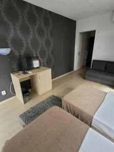 Postel nebo postele na pokoji v ubytování Guest House Taligarov