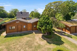an overhead view of a house with a tree at Strand Quartier in Timmendorfer Strand