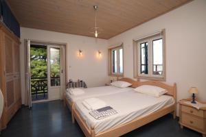 A bed or beds in a room at Villa Milma
