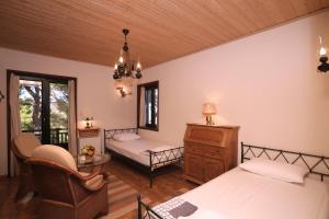 A bed or beds in a room at Villa Milma
