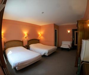 Ein Bett oder Betten in einem Zimmer der Unterkunft Hotel du Roy