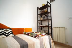 Posteľ alebo postele v izbe v ubytovaní Attico Via Capo Soprano