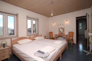 A bed or beds in a room at Villa Milma
