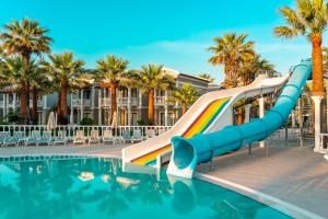 a slide in a pool at a resort at LUCAS DIDIM RESORT in Yenihisar