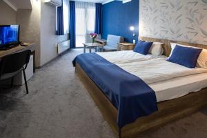 Katil atau katil-katil dalam bilik di Family Hotel Familia
