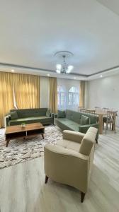 a large living room with couches and a table at KUDÜS APART in Bostancı