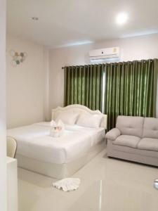 En eller flere senge i et værelse på Kantry's House กัญญ์ทรี่ เฮ้าท์