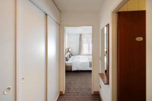 Postel nebo postele na pokoji v ubytování Downtown Vi Vadi Hotel + 37 fotografií