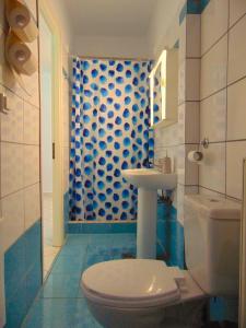 a bathroom with a toilet and a sink at Marilena Apartment, Keremies in Keramiaí