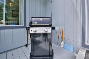 a grill sitting on a porch next to a window at Sandpiper Shores in Florence