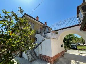 an external view of a building with a staircase at San Pietro D'orio Verde in Grado