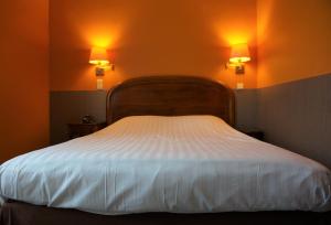 Ein Bett oder Betten in einem Zimmer der Unterkunft Hotel du Roy