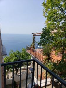 a balcony with a view of the ocean at Villa Pino in Furore