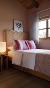 Säng eller sängar i ett rum på LA PERLA FINCA HOTEl- Cabaña Ágata
