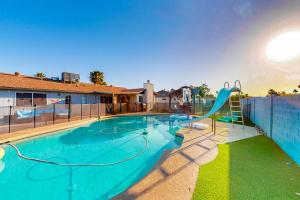 a swimming pool with a slide in a house at Pleasant Daydreams in Chandler