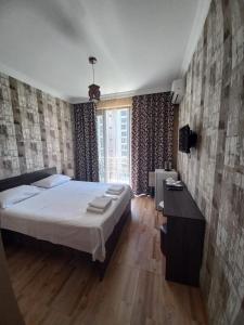 Postel nebo postele na pokoji v ubytování Astra + 26 fotografií