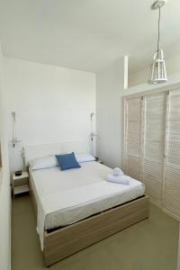 Postel nebo postele na pokoji v ubytování Blue Apartment