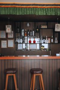 a bar with two stools in front of it at Mountain Resort in Nagarkot