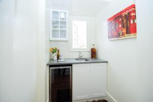 a kitchen with a sink and a window at The Craigmyle in Victoria