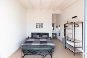 Voodi või voodid majutusasutuse New Rooftop Gem with stunning Oceanview toas