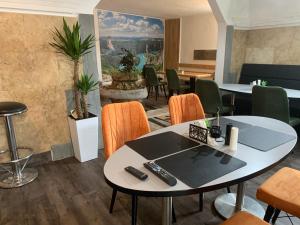 a room with a table with two remote controls on it at APARTMANI & RESTORAN -S O K O- SJENICA in Sjenica