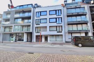 a van parked in front of a building at Appartement 3CH entièrement rénové Knokke - Centre in Knokke-Heist