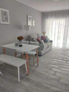 a living room with a couch and a table at Finca El Rabil in Cangas de Onís