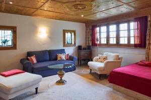 a living room with a couch and a table at Steinbachhof Chiemsee in Bernau am Chiemsee