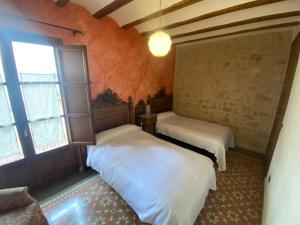 Postel nebo postele na pokoji v ubytování Casa Morató