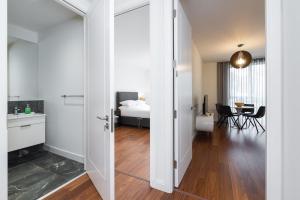 an open door to a bedroom with a bed at Fernbank One in Dublin +26 photos