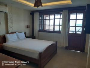 Postel nebo postele na pokoji v ubytování Hotel La Vista + 31 fotografií