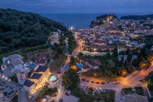 an aerial view of a city at night at Hara Suites in Parga