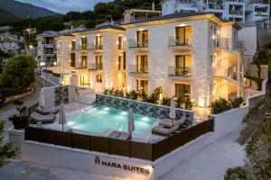 an aerial view of a hotel with a swimming pool at Hara Suites in Parga