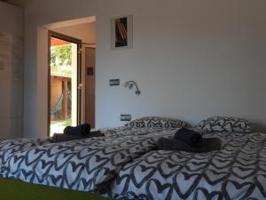 Łóżko lub łóżka w pokoju w obiekcie Villa Volcano