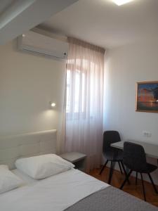 Postel nebo postele na pokoji v ubytování Marjan apartment & rooms