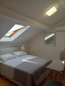 Postel nebo postele na pokoji v ubytování Marjan apartment & rooms