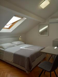 Postel nebo postele na pokoji v ubytování Marjan apartment & rooms