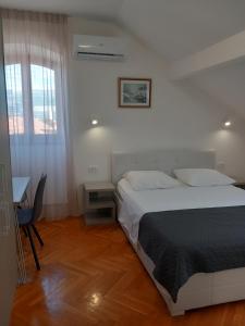 Postel nebo postele na pokoji v ubytování Marjan apartment & rooms