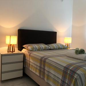 Кровать или кровати в номере Apartamento privativo e aconchegante na Orla