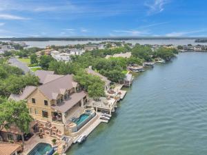 an aerial view of a house on the water at The Villa on Matern New Listing in Horseshoe Bay